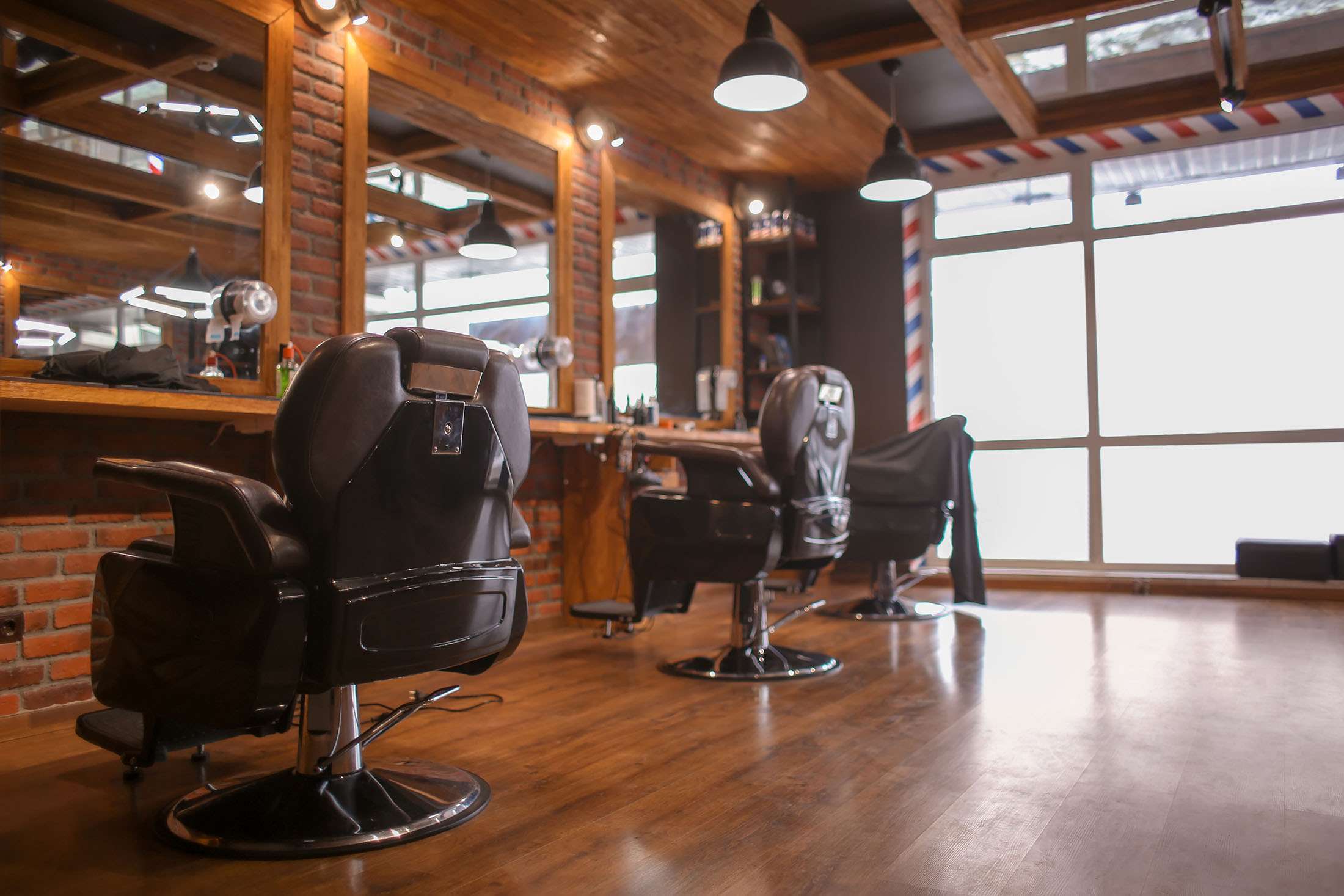 Stylish barber salon interior representing Fwresh on demand barber services in Boston MA